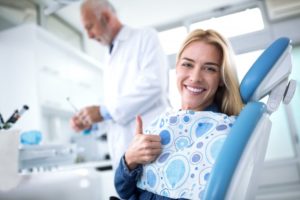 person smiling in dentist's office