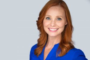 older woman smiling red hair